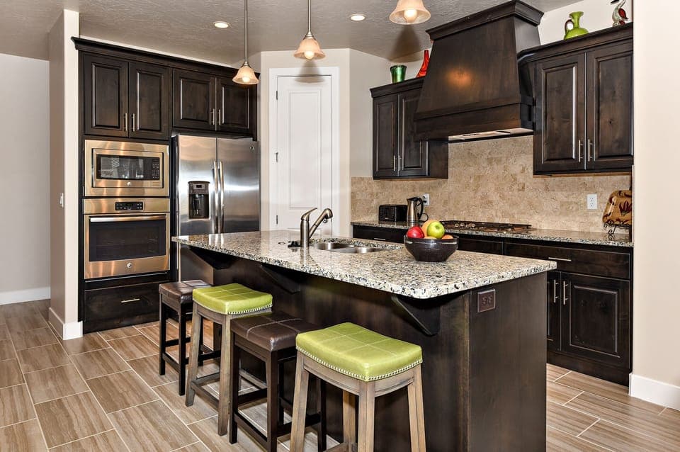 Kitchen - The Kitchen is complete with everything you will need for meal preparations including pots, pans, baking dishes, plates, cups, silverware, cutlery, and an assortment of cooking utensils.