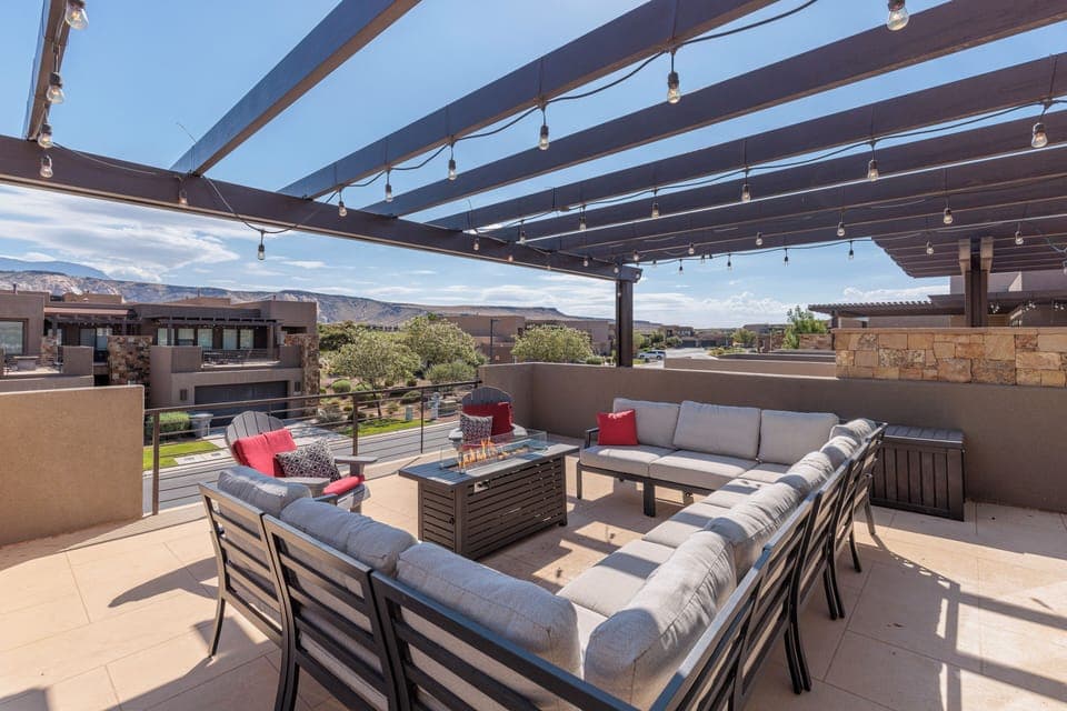 Balcony Patio - Stay warm next to the fire-pit and relax while watching the sunset over the red mountains.