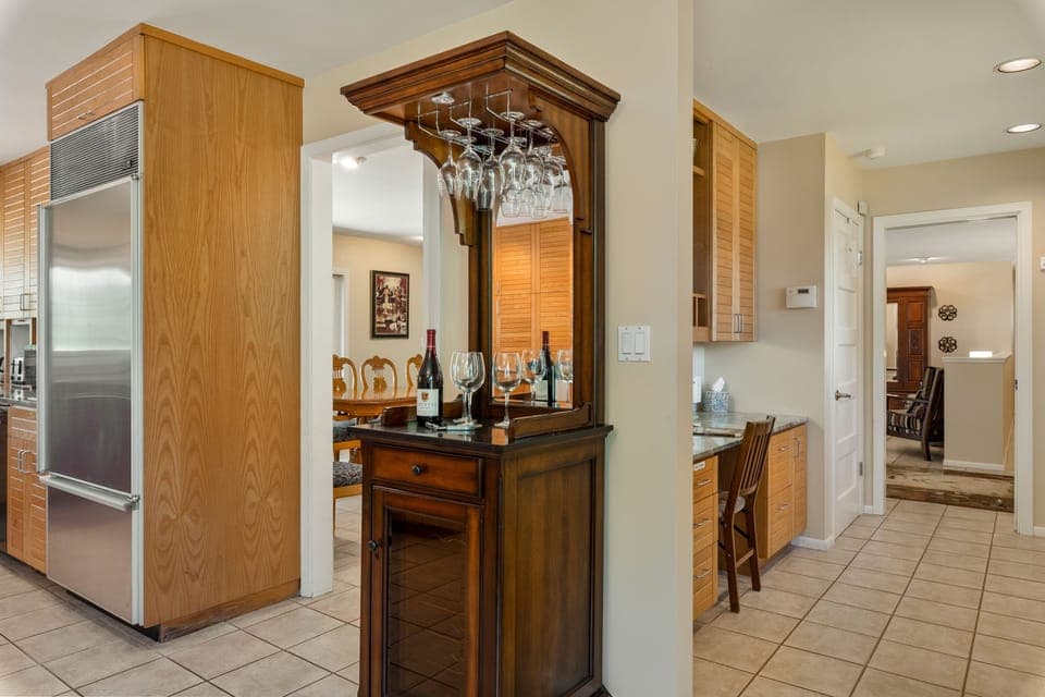 With a mini wine bar area to set up drinks and store your wine finds throughout the area.