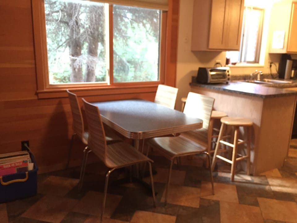 Breakfast nook between kitchen and sunken den. 
