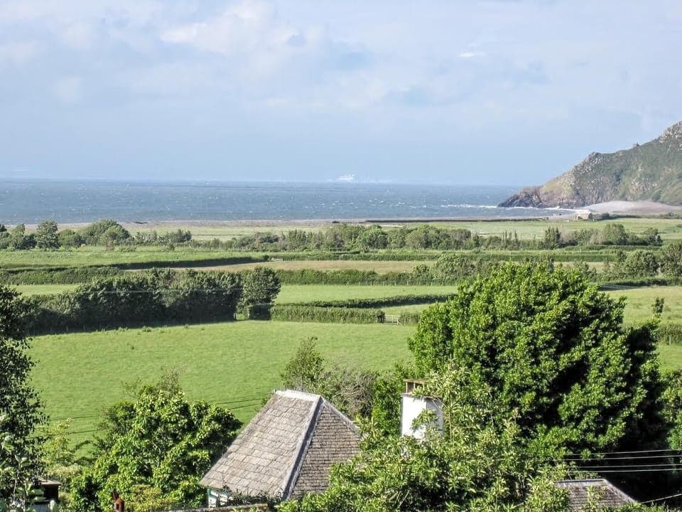 cottage roof with the fields beyond