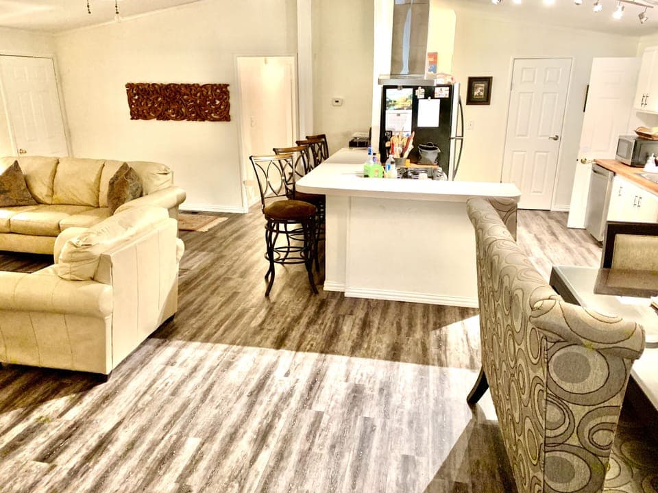 Living room, dining and kitchen areas.