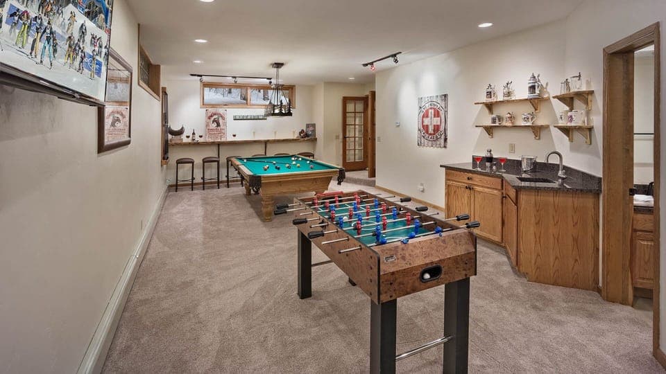 Rec room with billiards, foosball, Pac Man, TV area, wet bar and bath