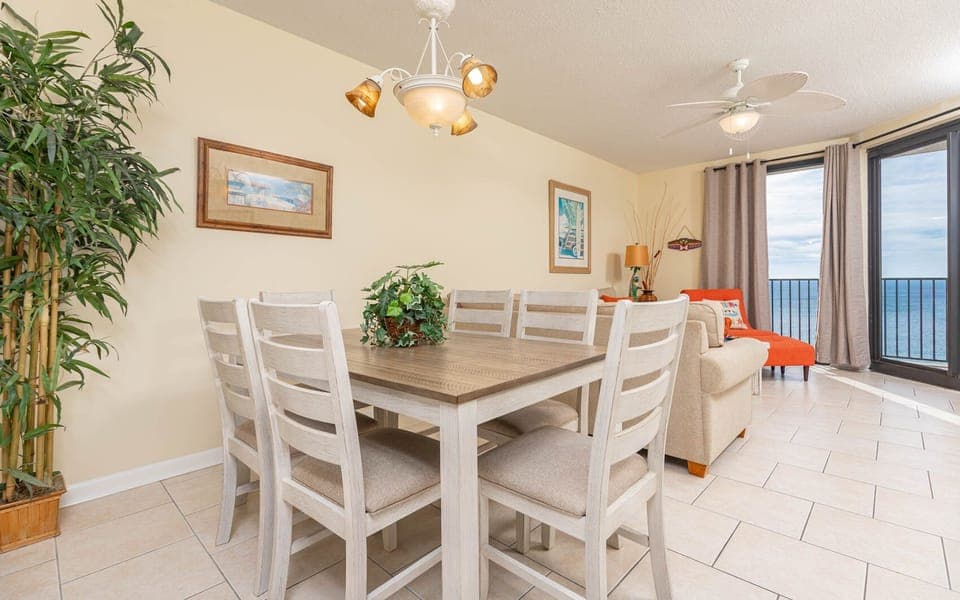 Dine comfortably at the light-filled table, with a view of the beach and vibrant decor enhancing your experience