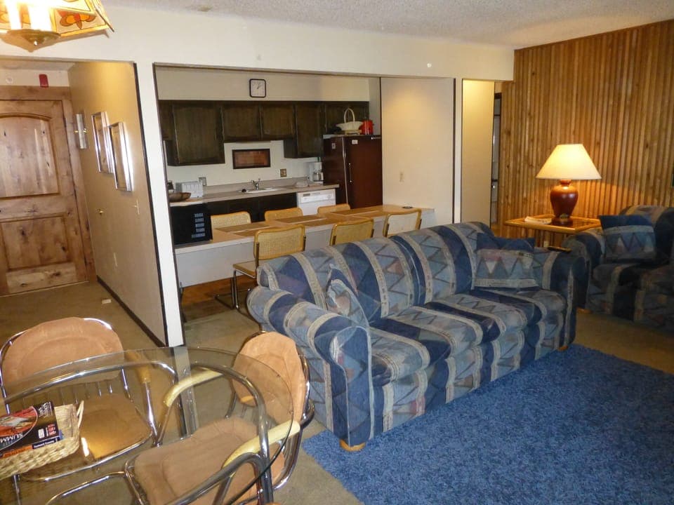 Facing sofa sleeper, kitchen and entrance way. 