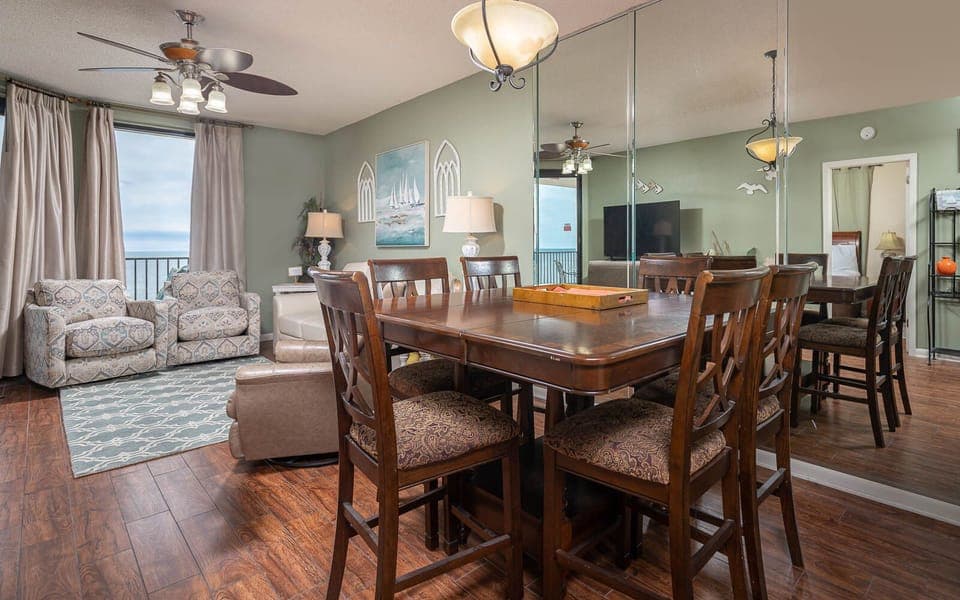 Enjoy meals at the dining table, surrounded by inviting decor and a relaxing atmosphere in this spacious living area