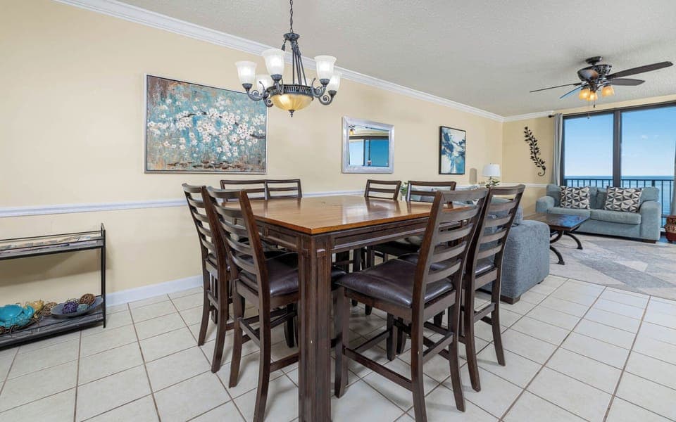 Dine at the spacious table surrounded by stylish seating, with a view that invites relaxation and conversation