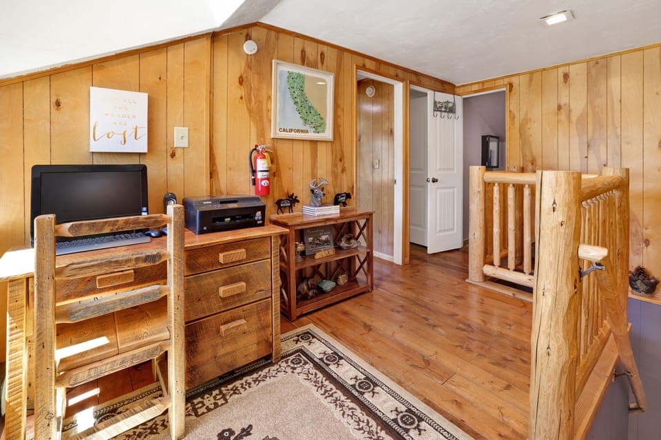 Peaceful cabin bedroom with plush bedding, and beautiful views—ideal for restful nights, cozy mornings, and a relaxing mountain escape.