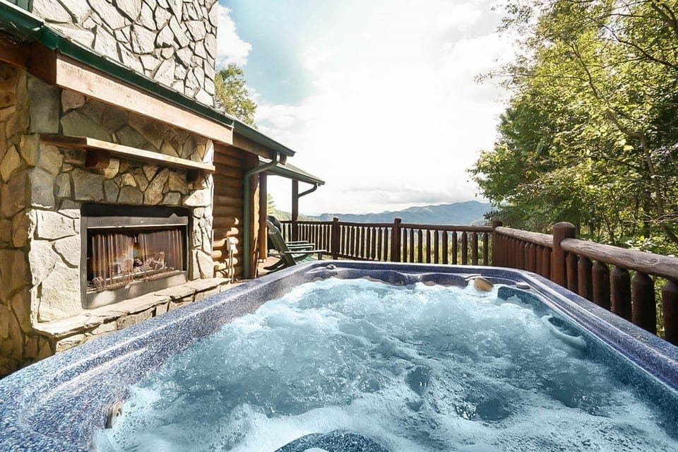 2019 main level hot tub deck and fireplace