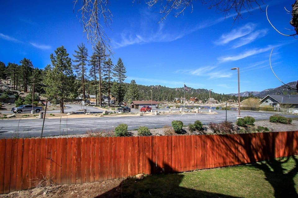 Step out onto the private balcony for a refreshing look at the surrounding pines and local landscape. This outdoor nook is ideal for morning coffee or simply soaking in the crisp mountain air.