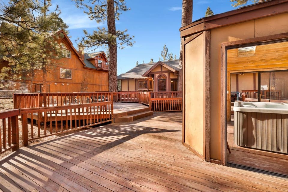 Private outdoor hot tub surrounded by tall pines, perfect for relaxing under the trees after a day of adventure—enjoy peaceful forest views, fresh air, and a truly rejuvenating stay.