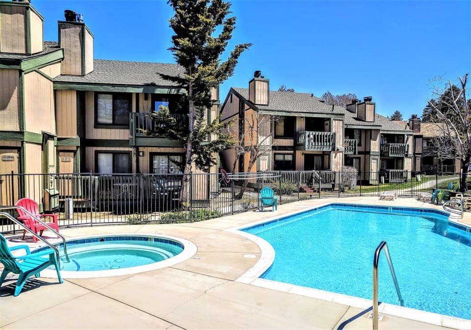 In addition to the large swimming pool, guests can enjoy a soothing soak in the adjacent hot tub. This gated outdoor facility is an ideal place to unwind after a long day of exploring.