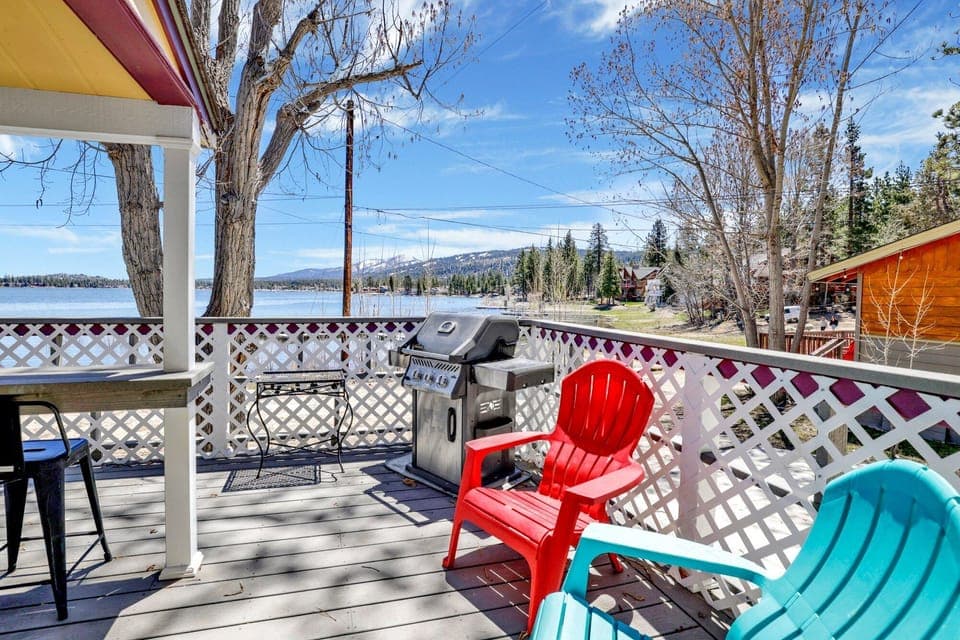 Private outdoor deck with comfortable seating and a BBQ, surrounded by tall pines, perfect for relaxing under the trees after a day of adventure—enjoy peaceful forest views, fresh air, and a truly rejuvenating stay.