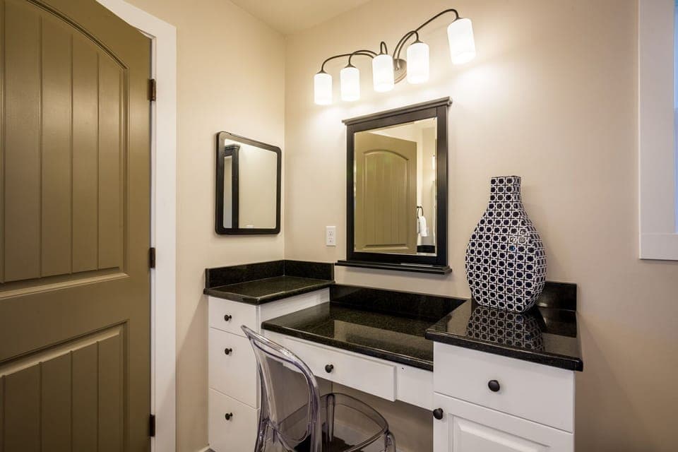 This spacious bath has a mirrored make-up vanity.