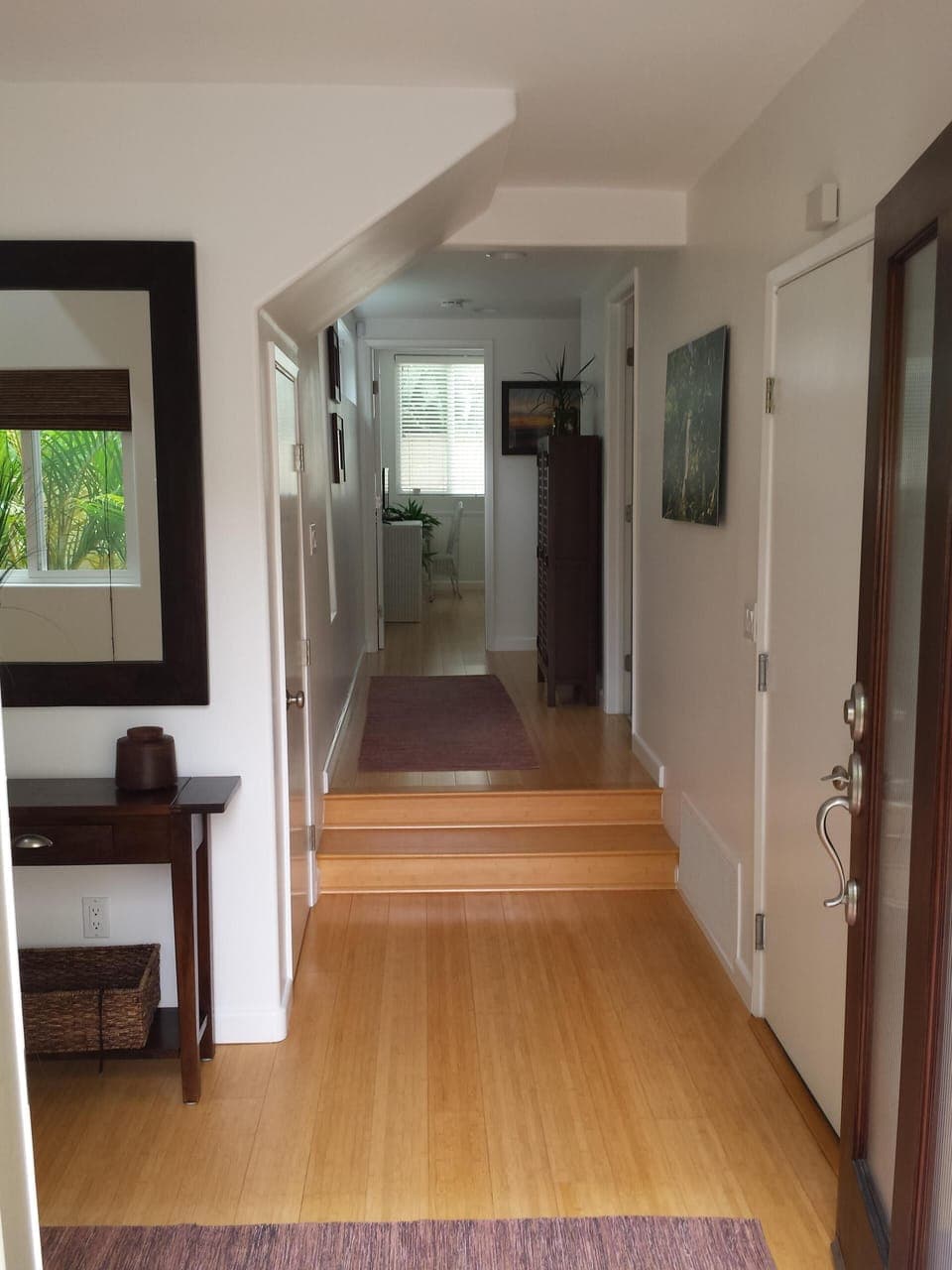 Entry to your beach vacation with bamboo floors and coastal furnishings