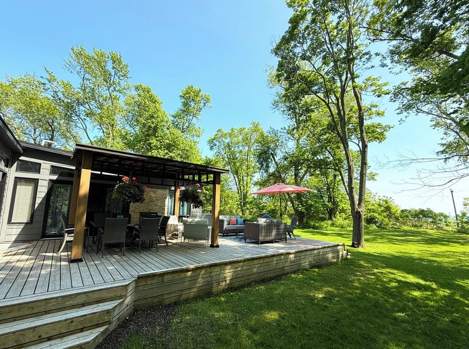The wide sandy beach is only a few steps away from this inviting outdoor space. 