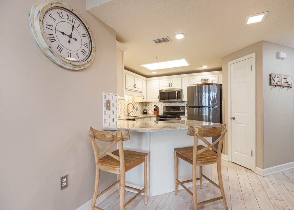 Enjoy casual meals at the stylish breakfast bar, surrounded by the modern kitchen and charming decor