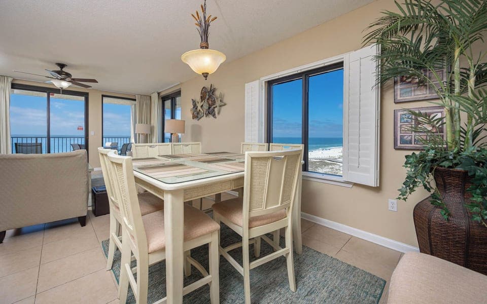 Dine at the table while enjoying panoramic views of the coast through large windows that invite natural light