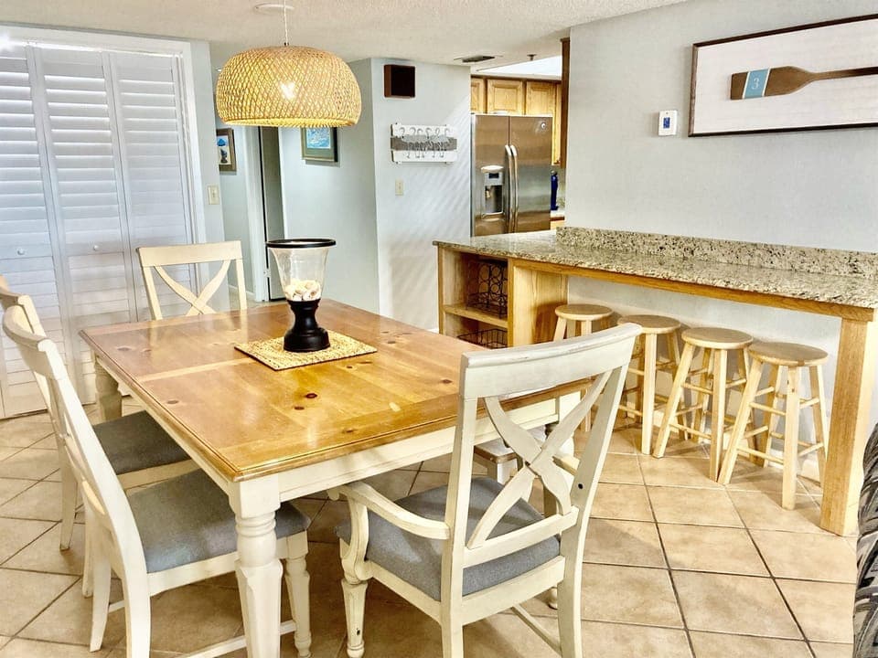 Dining for 6 (or more with bench) at the dining room table and 4 at the bar area!