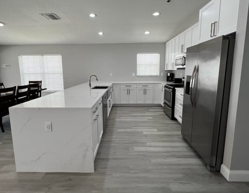 Beautifully updated kitchen with stainless steel appliances and - Beautifully updated kitchen with stainless steel appliances and plenty of prep space for your whole crew.