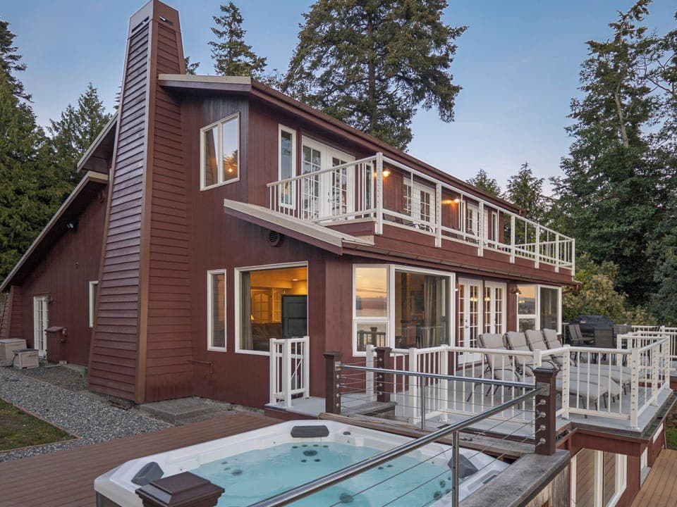 Each floor of this home features its own private balcony. The main floor balcony leads to the barbecue area.