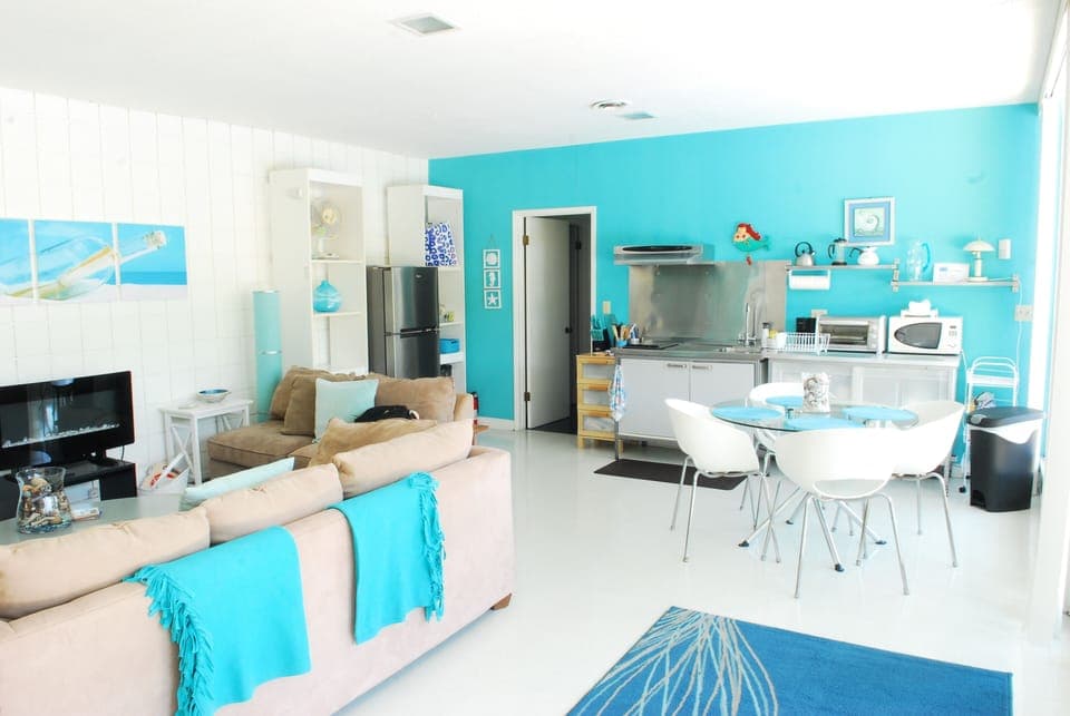 Newer photo Living room reverse angle at efficiency kitchen