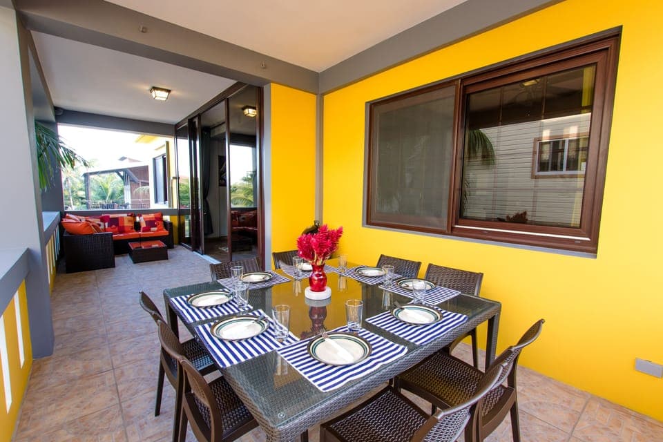 Veranda with dinning table and outdoors sofa 