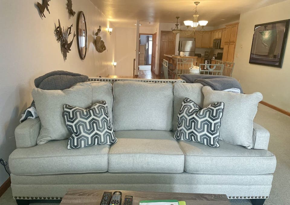 New comfy couch in the living room facing the river.