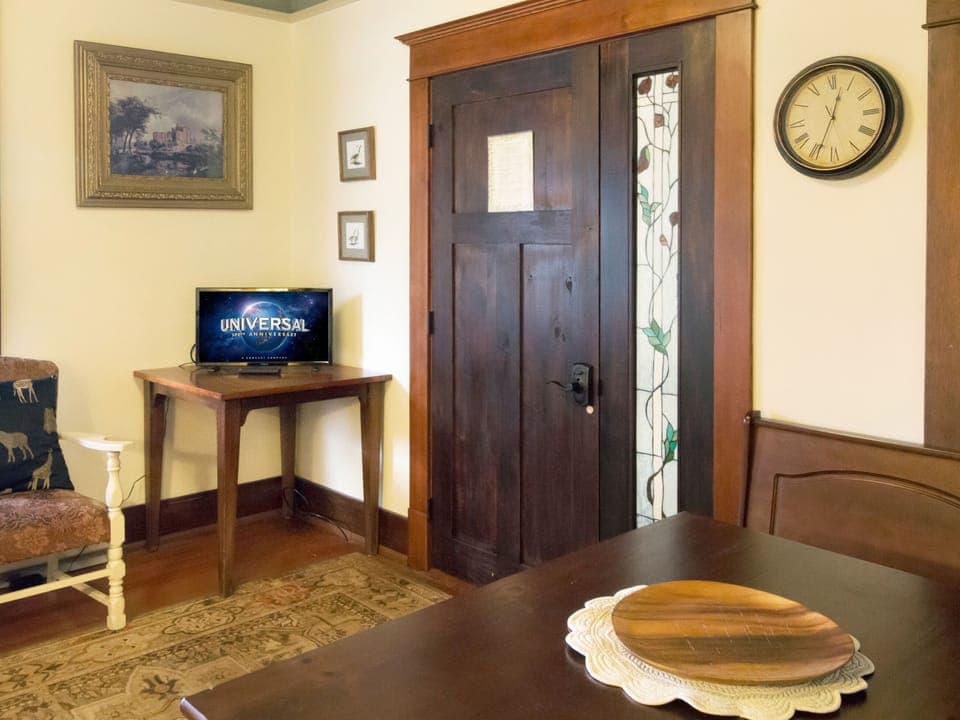 Smart TV and bench sitting area.