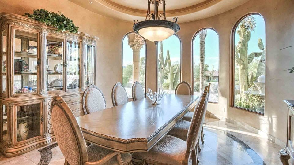 8-person formal dining room w/ front yard views & large windows