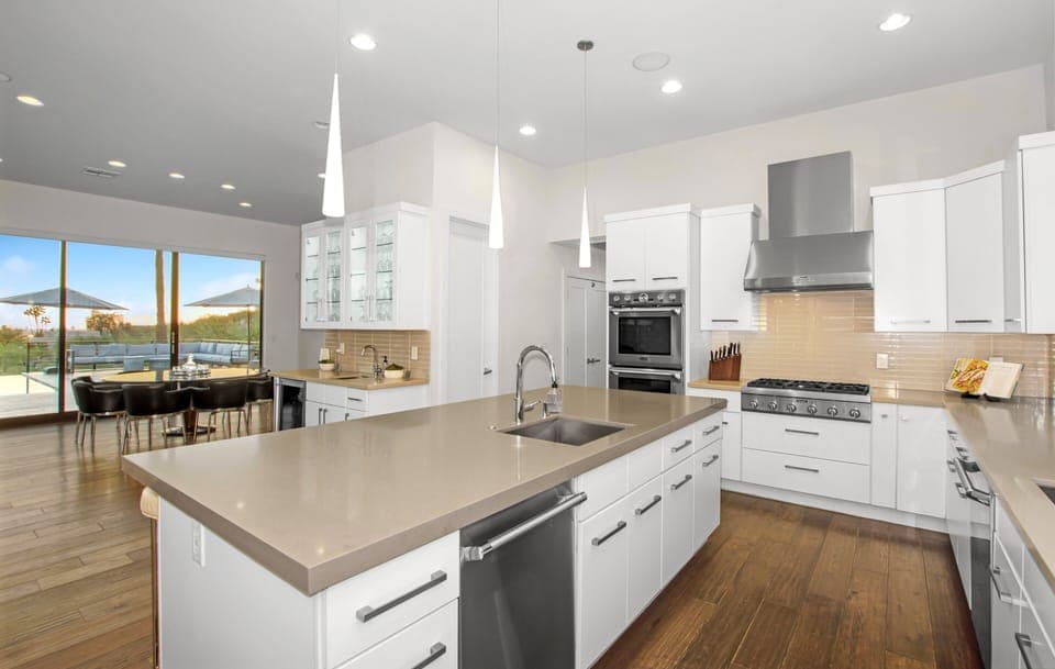 Cook, gather, and unwind in style—this stunning Arizona kitchen features high-end appliances, a spacious island, and breathtaking views, perfect for unforgettable moments with family and friends.