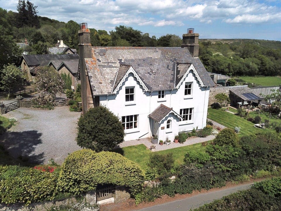 Town Barton, Manaton. Guest car park to the left, walled garden to the right.
