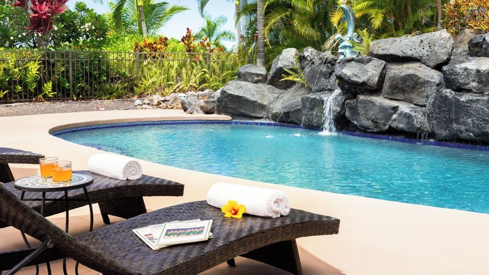 Relaxing pool with a waterfall and fountain 