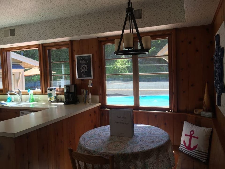 Built in banquette in kitchen...view of pool!  