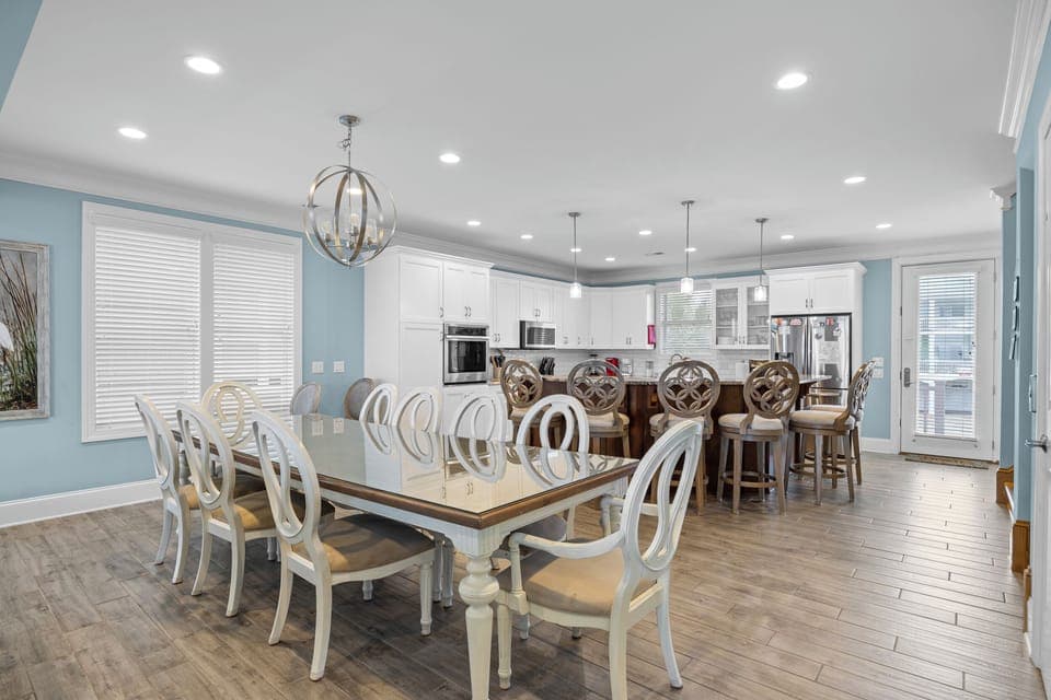 Gather around this elegant dining table for memorable meals, then chat at the kitchen island in your beautifully appointed space.