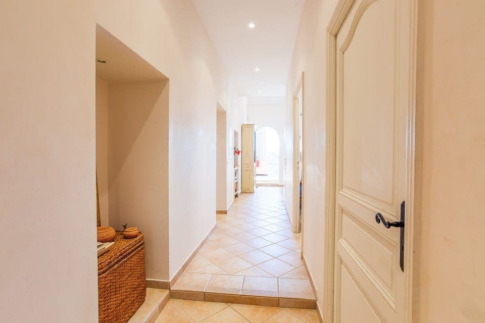 The hallway leading to the living room and kitchen