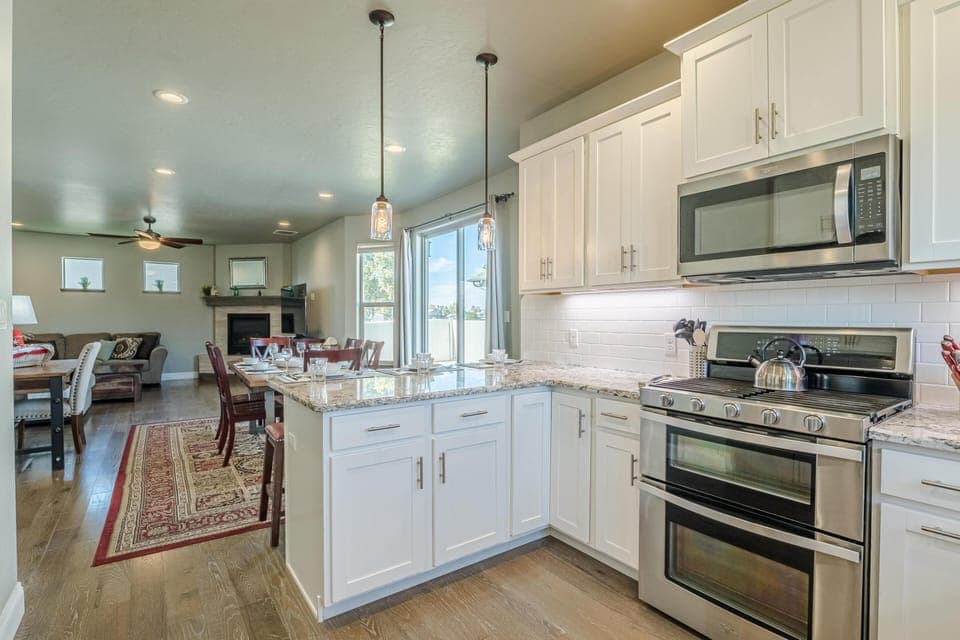 Bright, open kitchen with modern appliances and cozy dining area