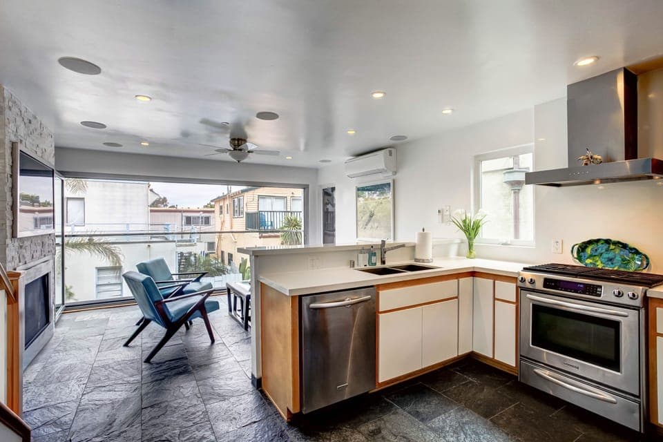 Kitchen family room area with windows all open. 