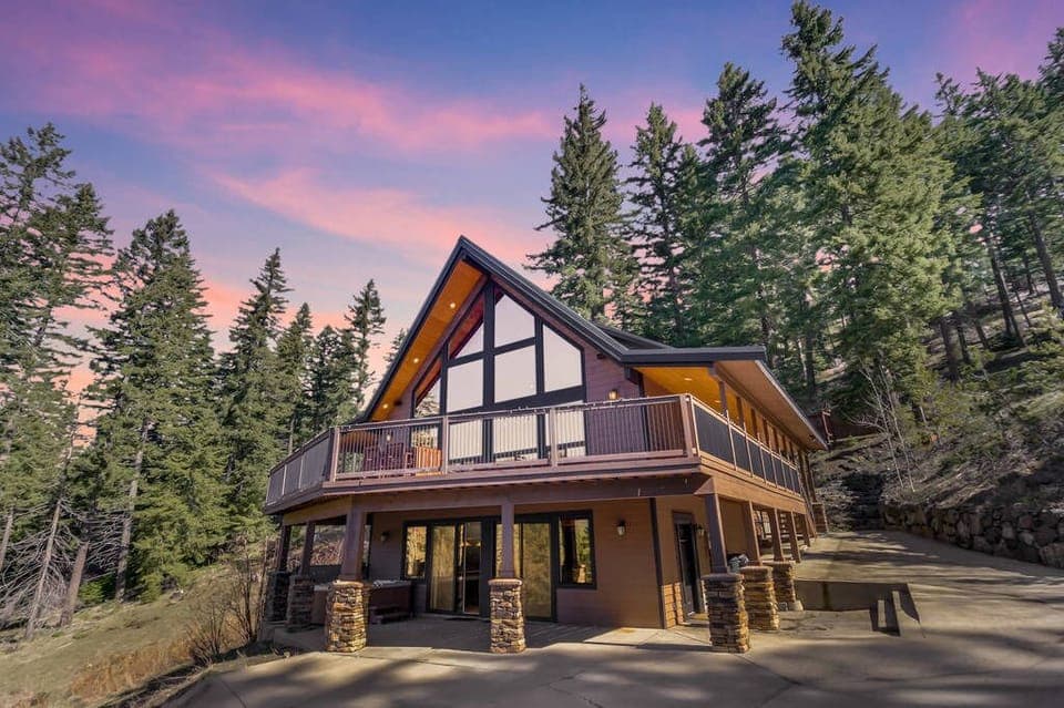 Crestview Lodge - Vacation Rental 365 - Timber-frame mountain lodge with grand A-frame windows and dramatic roofline