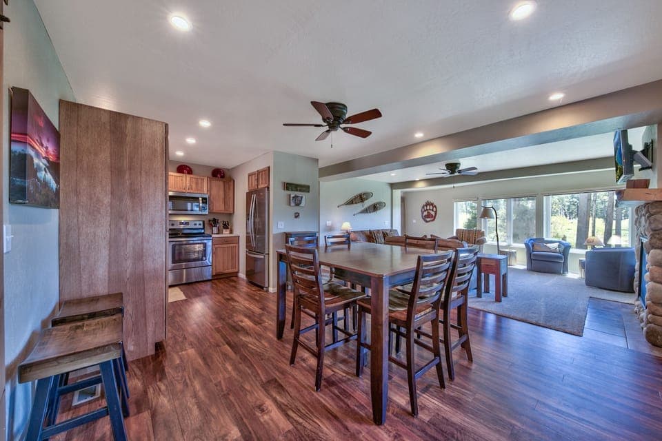 Dining table seats 8 (6 chairs around the table, 2 stools on the left can be used for additional seating at table)