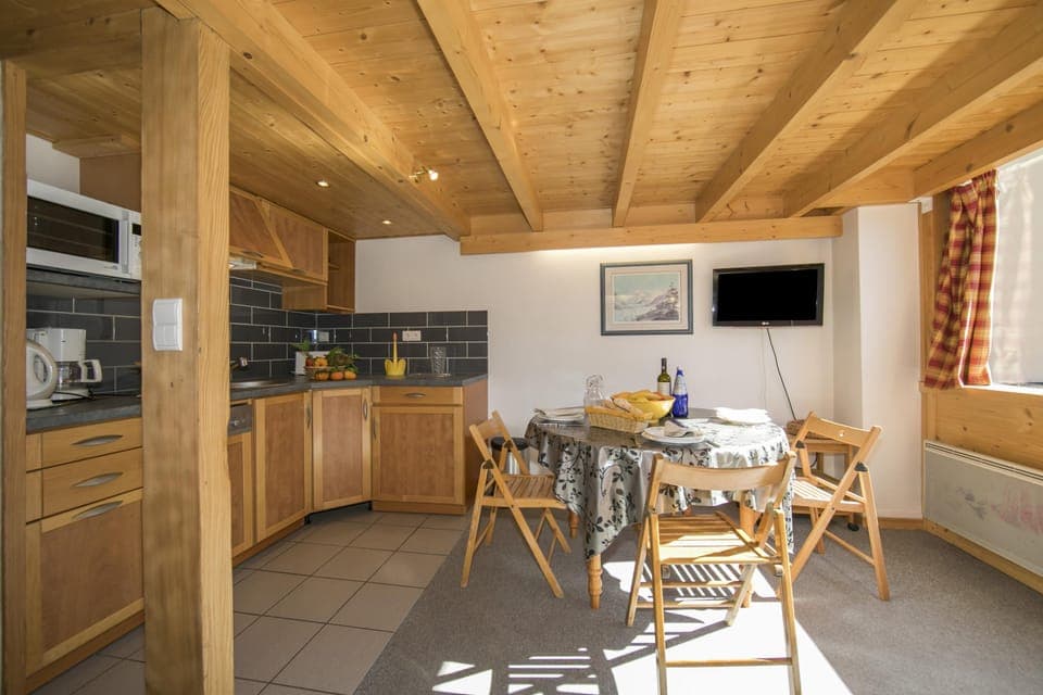 Kitchen with dishwasher and dining set