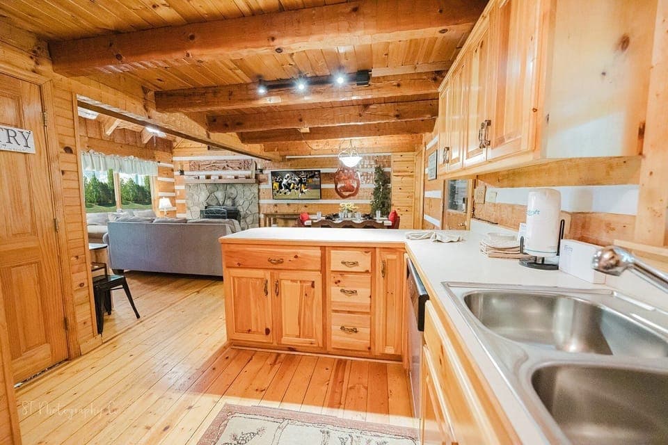 Kitchen island with deep sink and ample counter space at A Slice of Heaven cabin rental in Wears Valley, Tennessee — 15 minutes from Pigeon Forge attractions