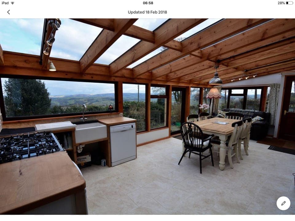 Conservatory, kitchen and dining for 13 people, with spectacular views