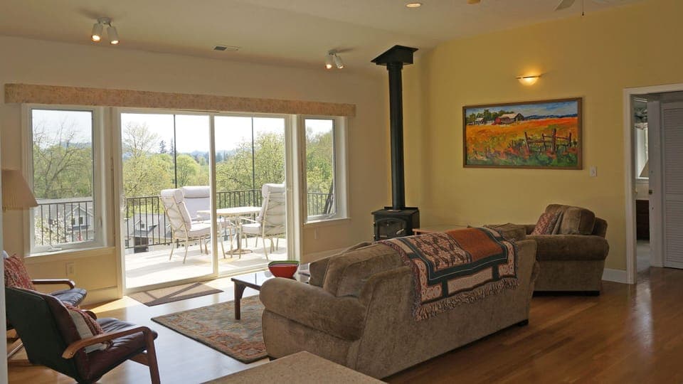 Great room and deck look over the McKenzie Valley