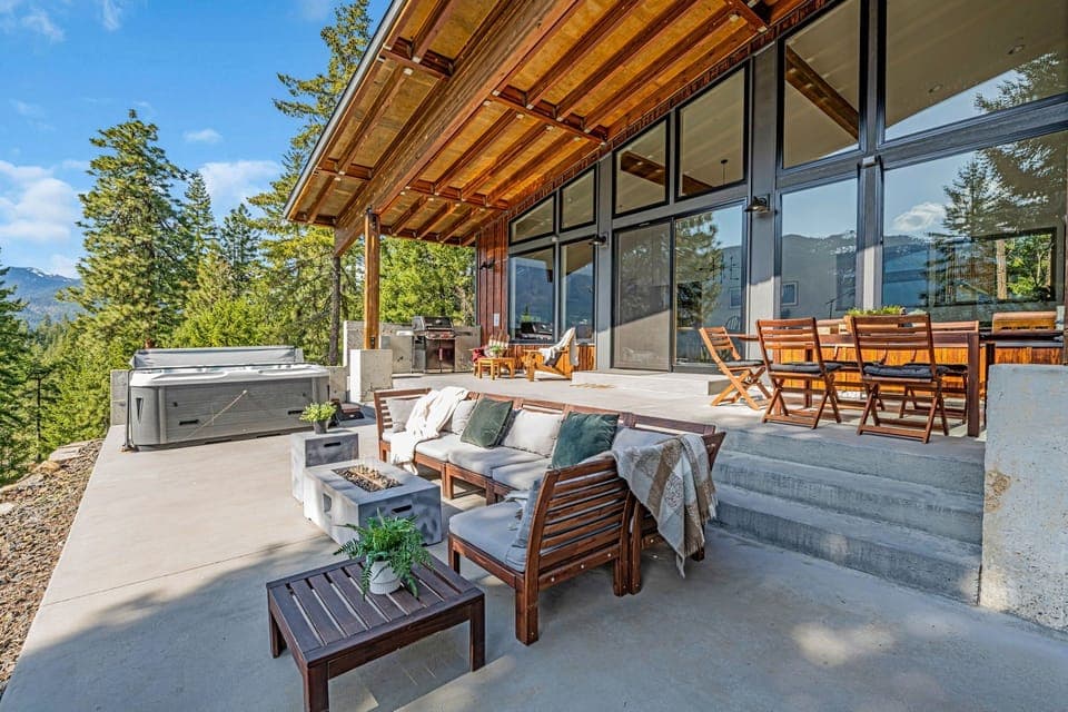 Mountain-view patio, hot tub, fire pit, and lounge seating