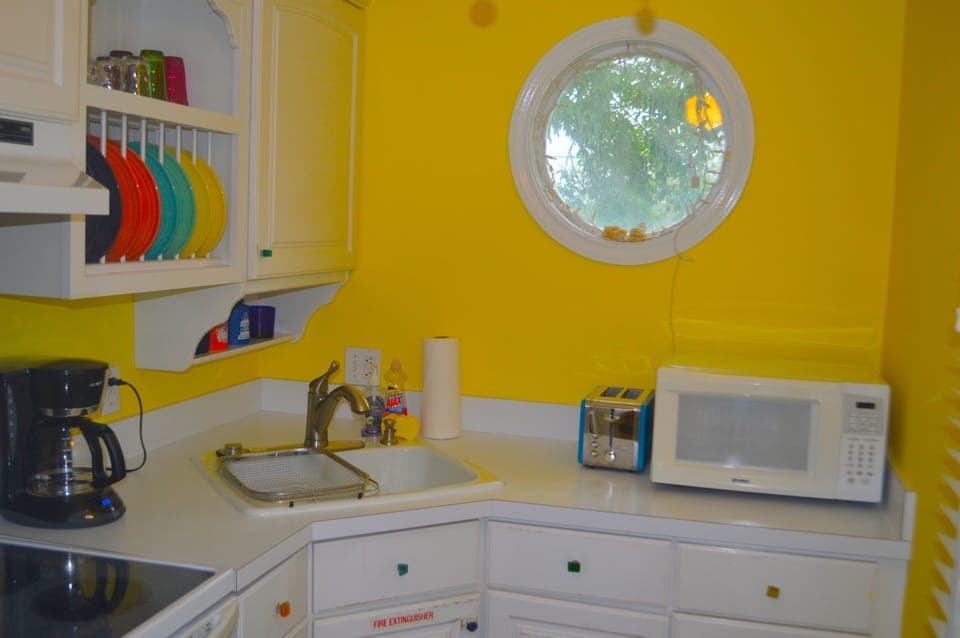 Kitchen has dishwasher, quartz countertops and fiestaware!