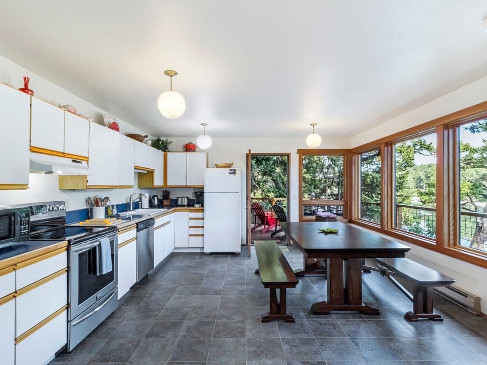 Open Kitchen area with bench seating around dining table