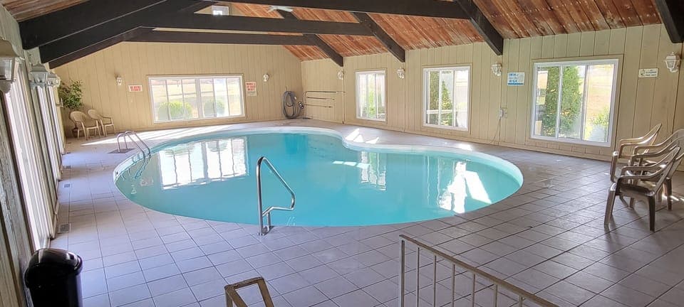 Pool room is 30' X 60' Pool is 20' X 40'. 9' deep end, 3' to 5' shallow end.