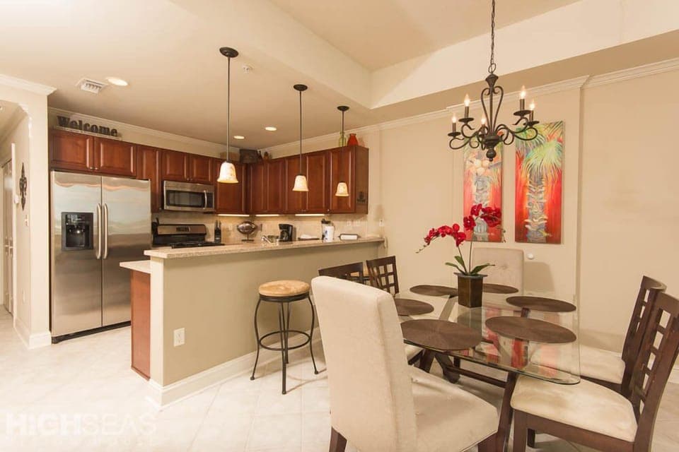 The dining room and kitchen. Dining room table seats 6; breakfast bar seats 2.