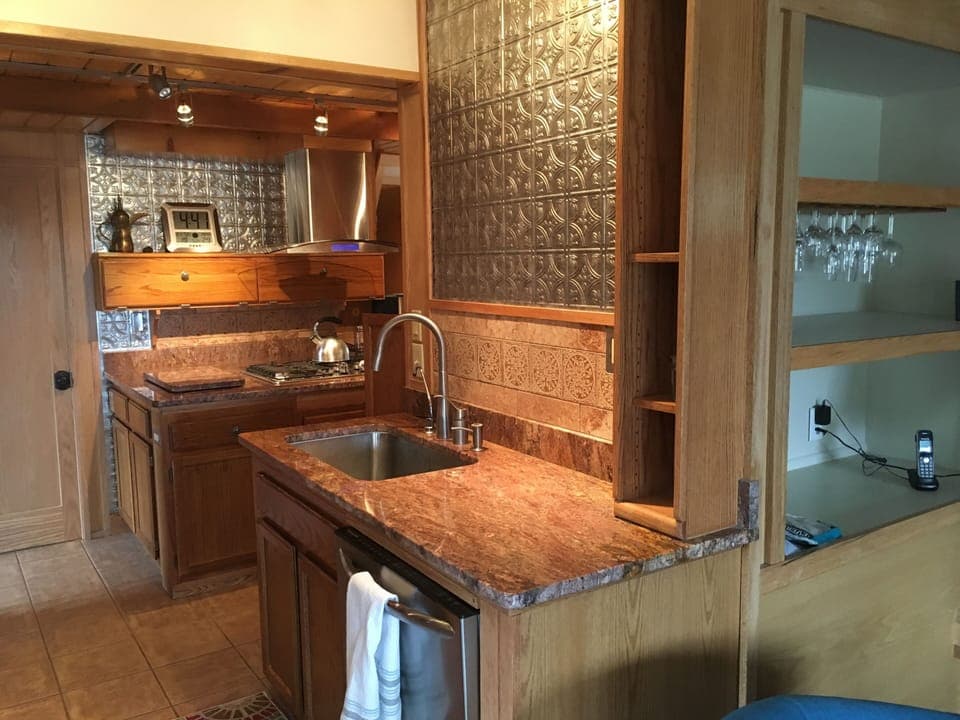 Granite and stainless steel in living room.